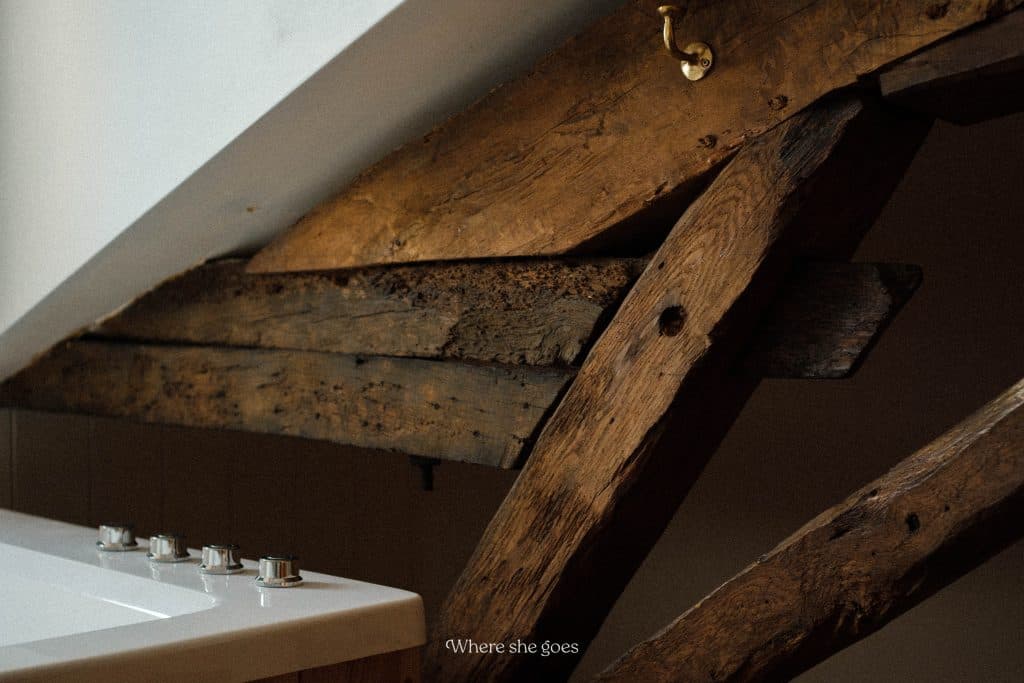 The wooden beams inside our room at Plates Farm Hotel